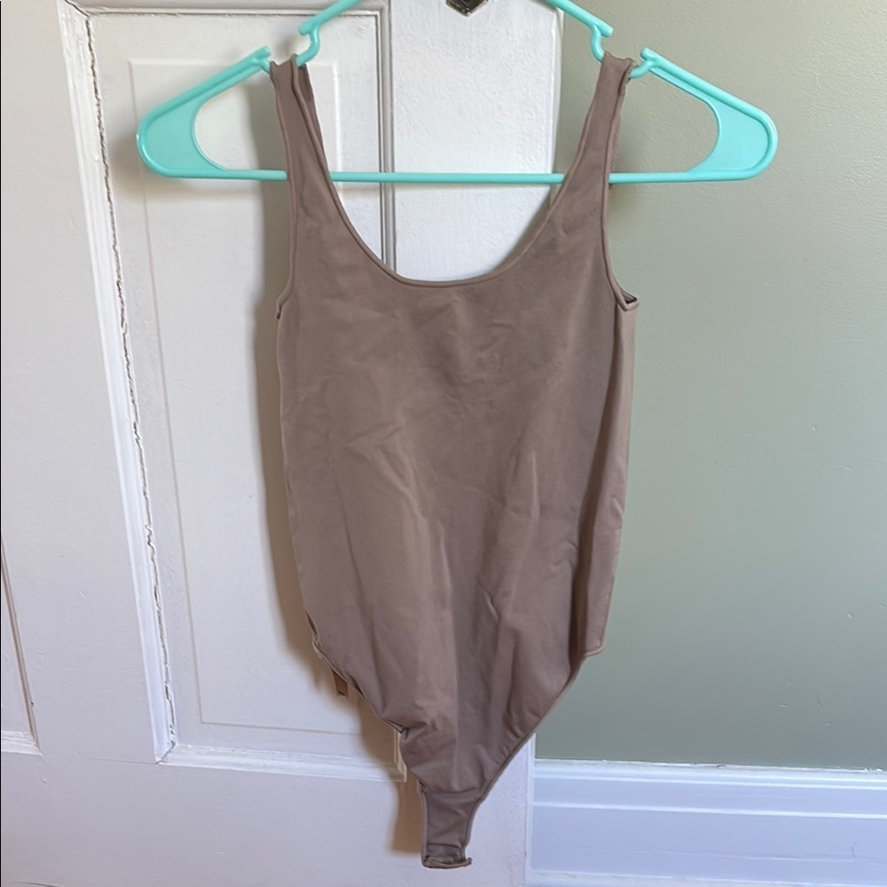 SKIMS Tan Bodysuit with Scoop Neckline and High-Cut Legs